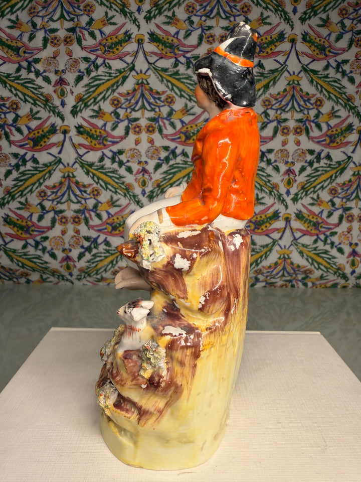 Staffordshire Pottery Figure of a Seated Youth with Sheep