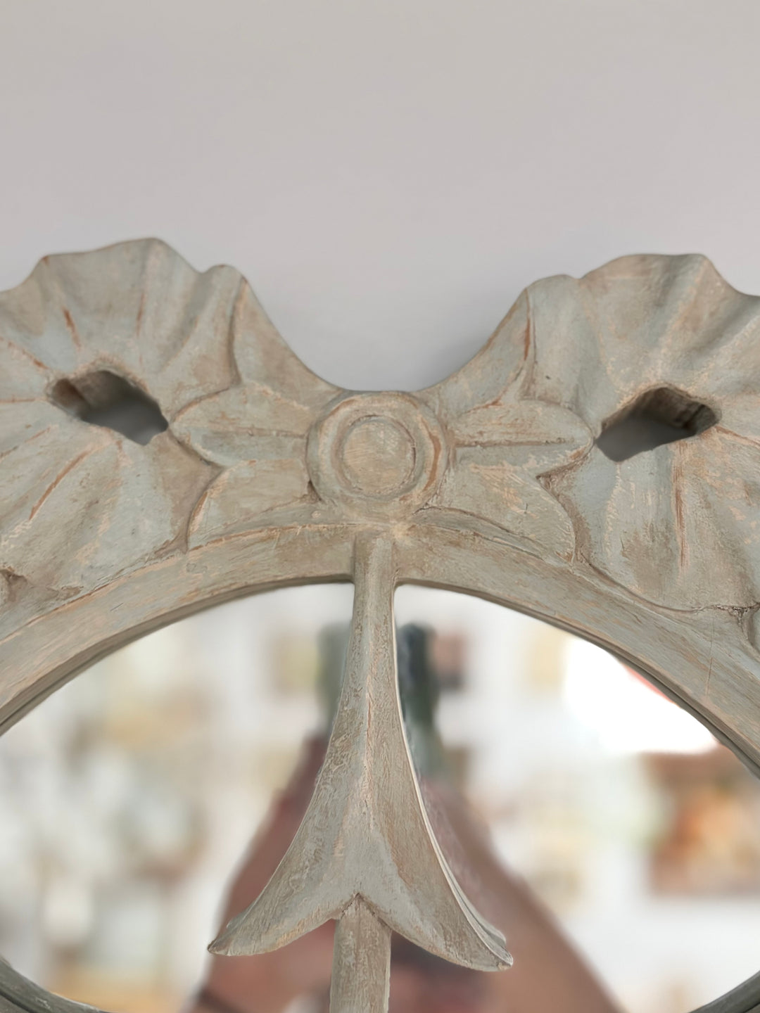 Pair of Oval White Carved Resin Wall Mirrors with Bow & Arrow Motif