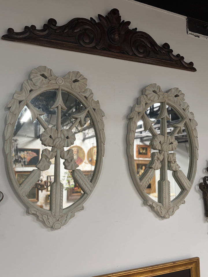 Pair of Oval White Carved Resin Wall Mirrors with Bow & Arrow Motif