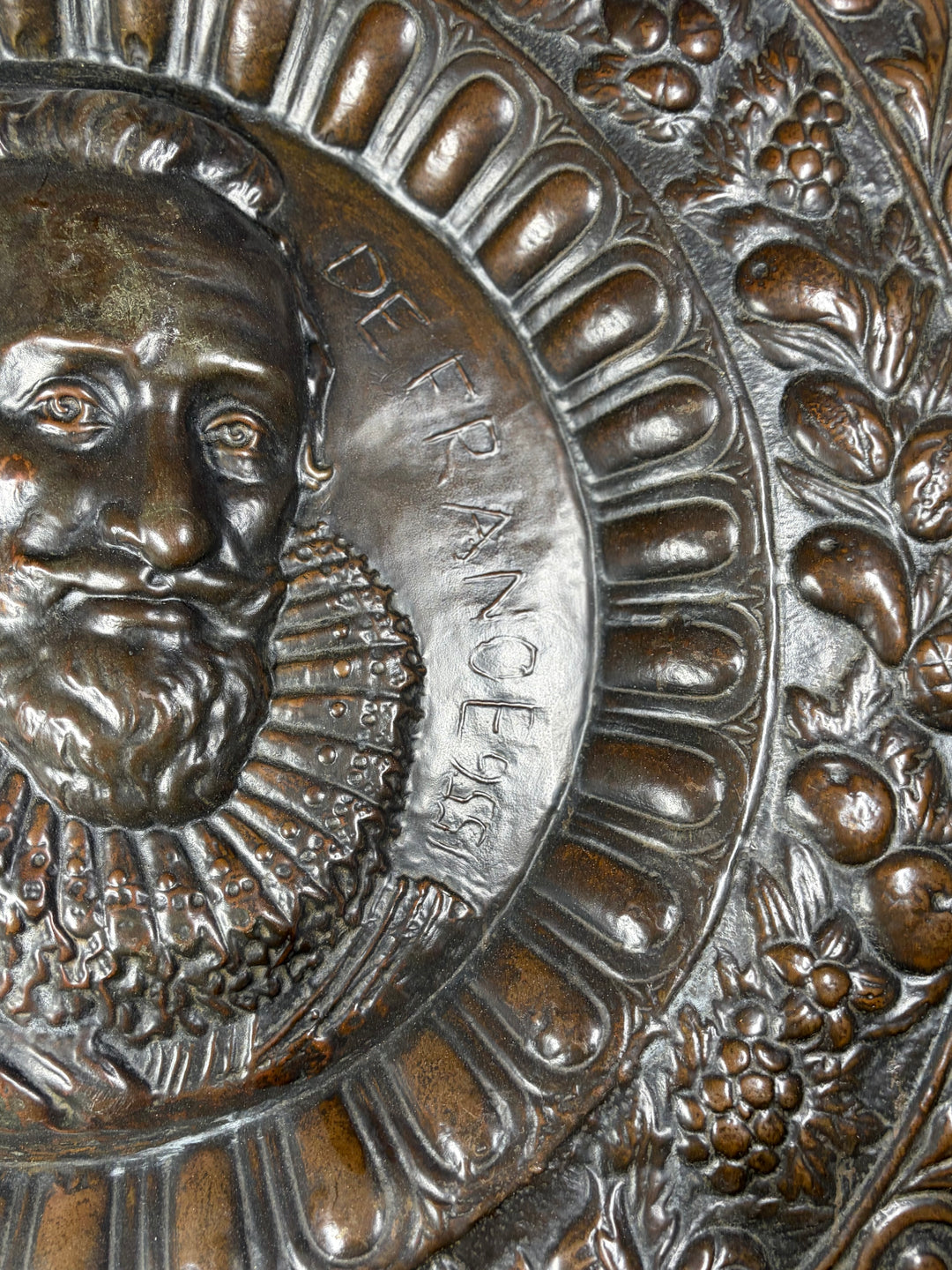 Pair of Large Bronze Relief Chargers with Portrait Bust and Heraldic Decoration