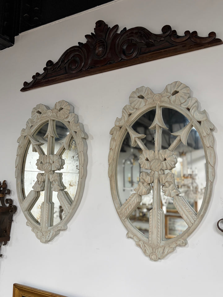 Pair of Oval White Carved Resin Wall Mirrors with Bow & Arrow Motif