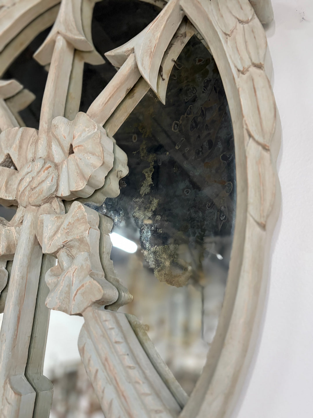 Pair of Oval White Carved Resin Wall Mirrors with Bow & Arrow Motif