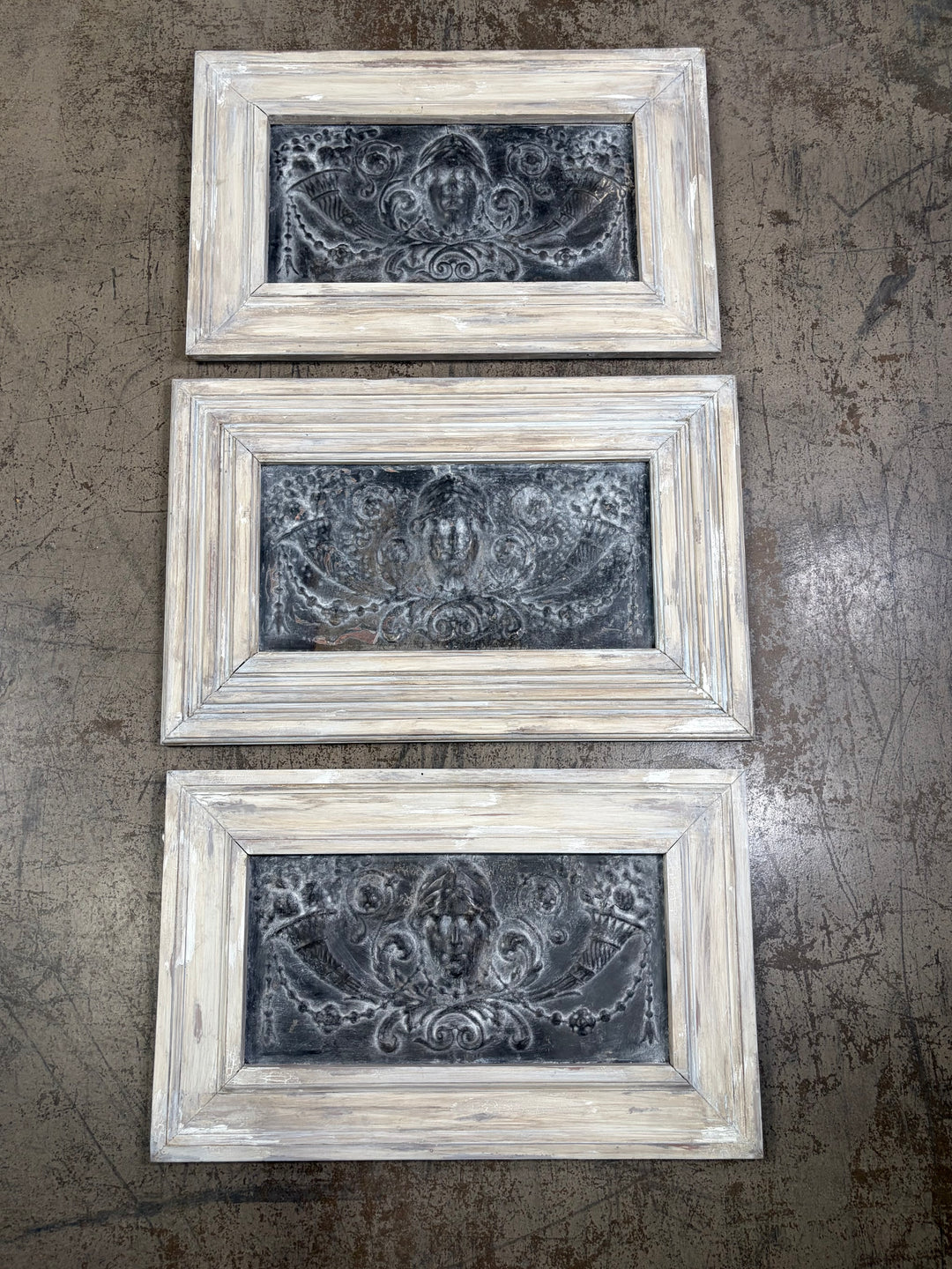 Set of Three Framed Embossed Metal Panels with Classical Face Motif