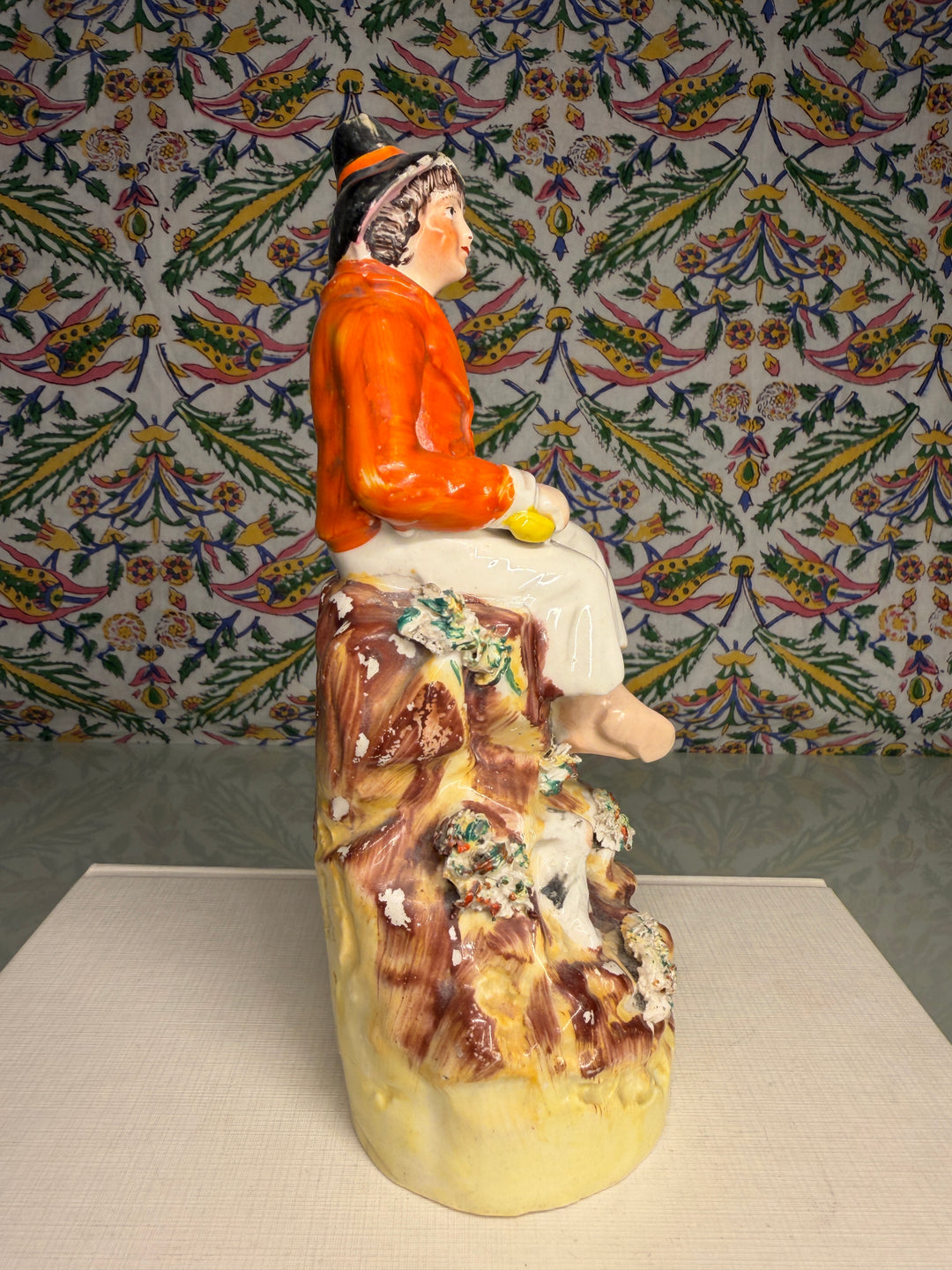 Staffordshire Pottery Figure of a Seated Youth with Sheep