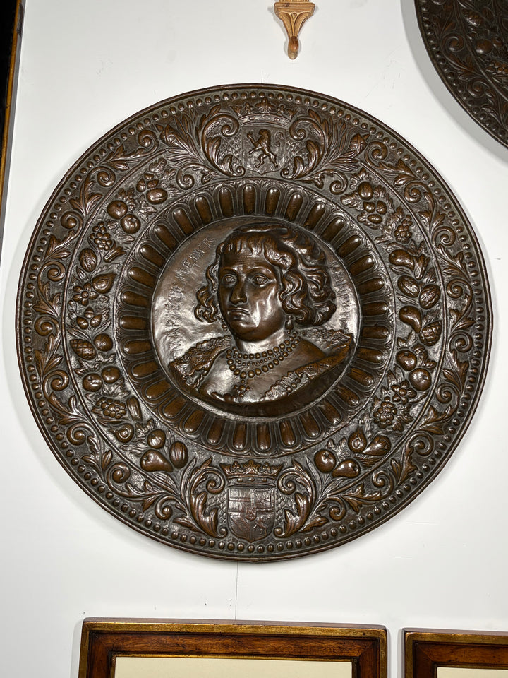 Pair of Large Bronze Relief Chargers with Portrait Bust and Heraldic Decoration