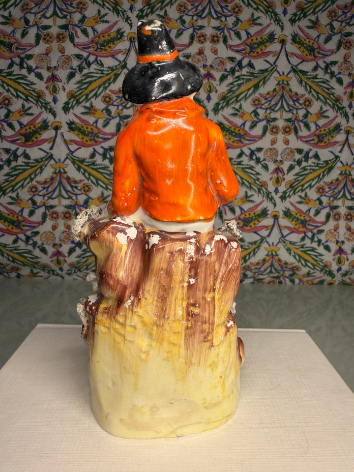 Staffordshire Pottery Figure of a Seated Youth with Sheep