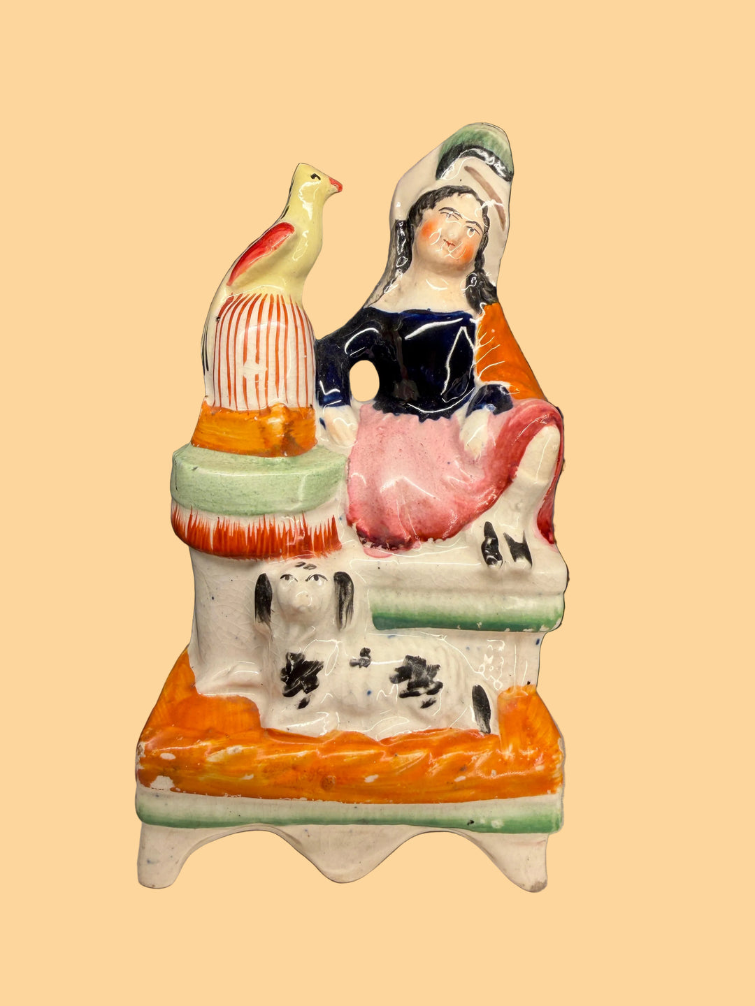 Staffordshire Pottery Figure of a Seated Woman with Bird and Dog