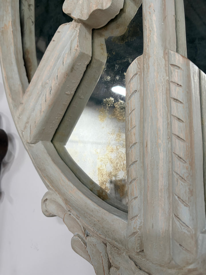 Pair of Oval White Carved Resin Wall Mirrors with Bow & Arrow Motif