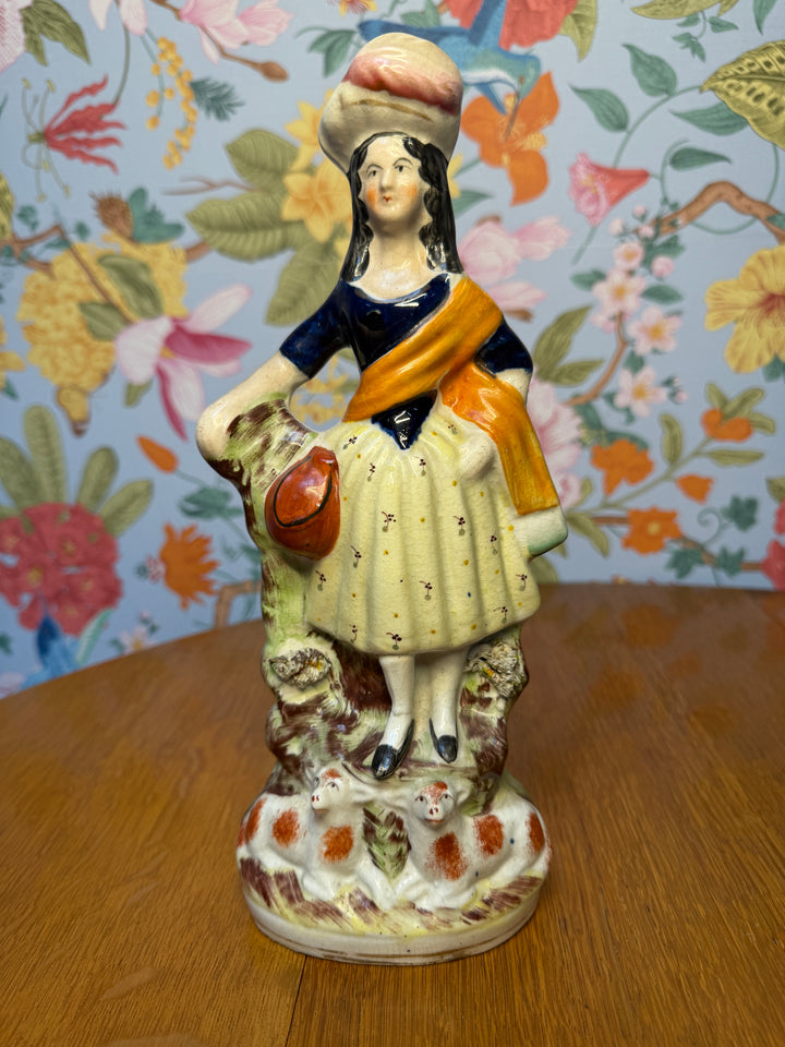 Woman and Two Orange Lambs