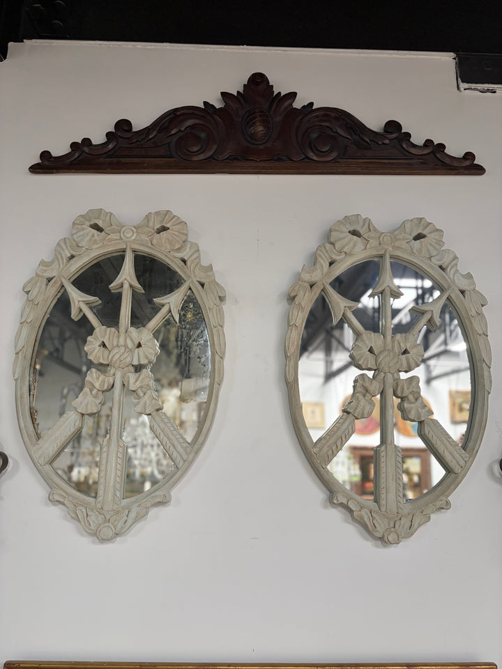 Pair of Oval White Carved Resin Wall Mirrors with Bow & Arrow Motif
