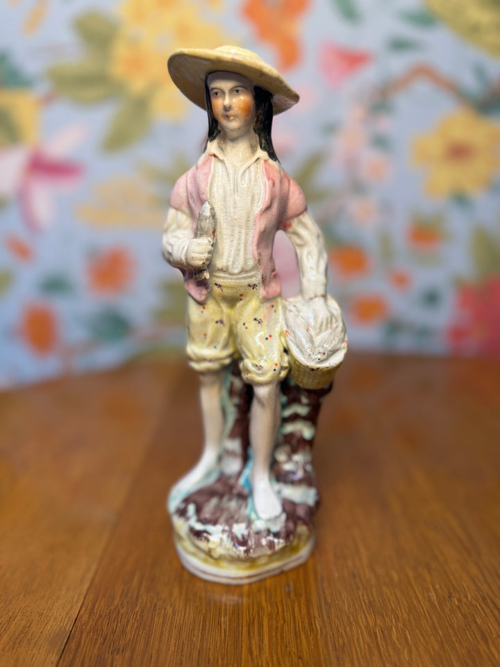 Antique Staffordshire Man with Fish Basket