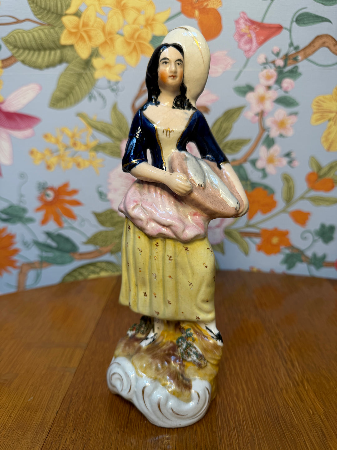 Antique Staffordshire Woman holding two fish