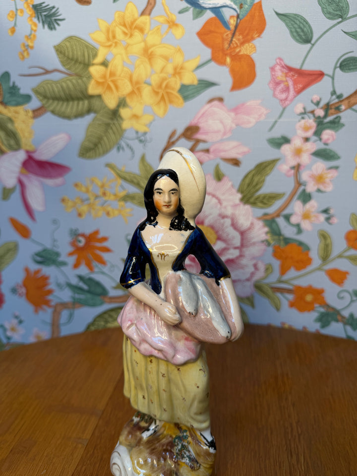 Antique Staffordshire Woman holding two fish