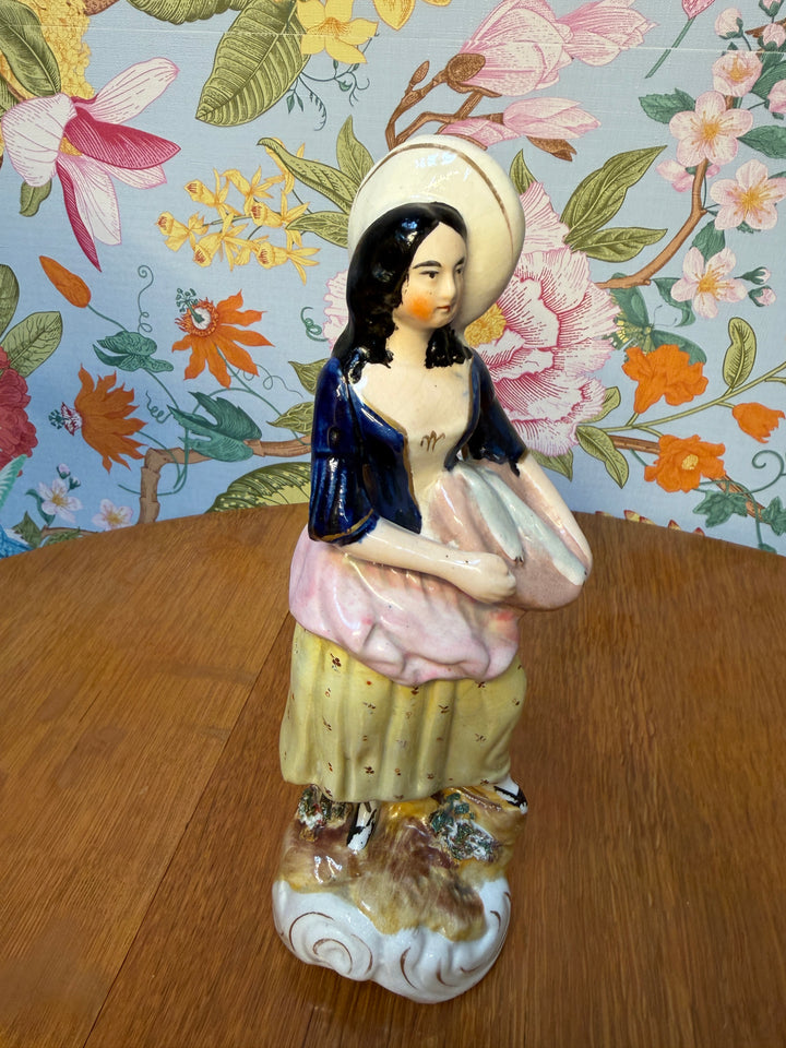 Antique Staffordshire Woman holding two fish